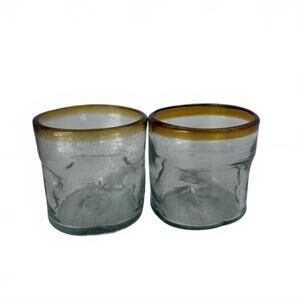 A pair of 3.5” tall hand-blown Mexican glass tumblers with amber rims